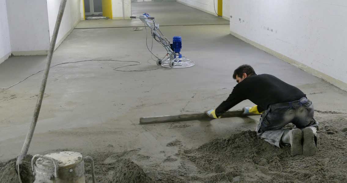 Screed-laying in a supply tunnel of the Virchow Hospital Campus of Charité Berlin